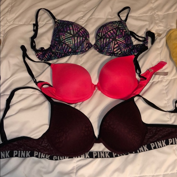 Three pink padded bras